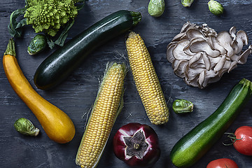 Image showing Organic vegetables on wooden table. Top view