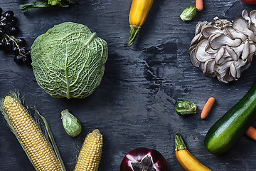 Image showing Organic vegetables on wooden table. Top view