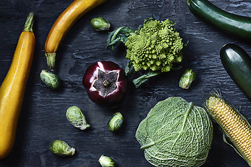 Image showing Organic vegetables on wooden table. Top view