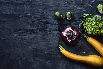 Image showing Organic vegetables on wooden table. Top view