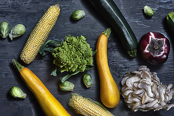 Image showing Organic vegetables on wooden table. Top view