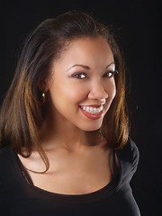 Image showing Young black woman with big smile and braces