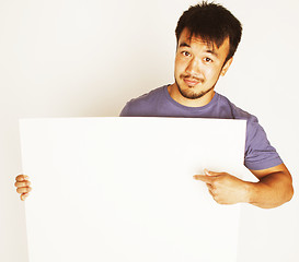 Image showing pretty cool asian man holding empty white plate smiling