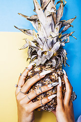 Image showing lifestyle people concept. young pretty smiling indian girl with pineapple, asian summer fruits 