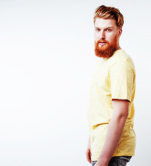 Image showing young handsome hipster ginger bearded guy looking brutal isolate