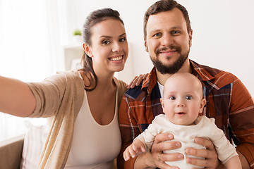 Image showing mother and father with baby taking selfie at home