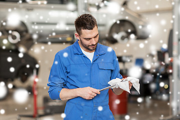 Image showing auto mechanic or smith with wrench at car workshop