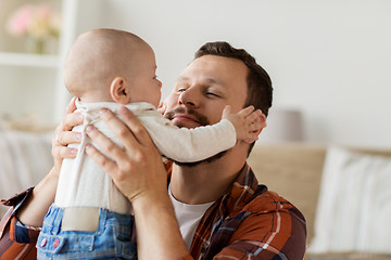 Image showing close up of father with little baby boy at home