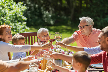 Image showing happy family having dinner or summer garden party