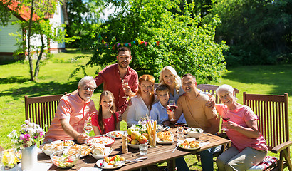 Image showing happy family having dinner or summer garden party