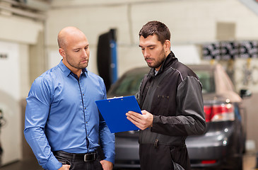 Image showing auto mechanic and customer at car shop