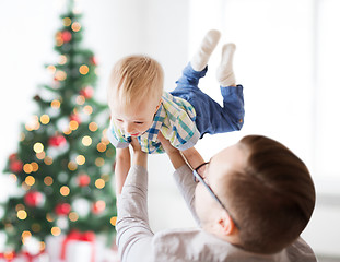 Image showing happy father playing with son at christmas