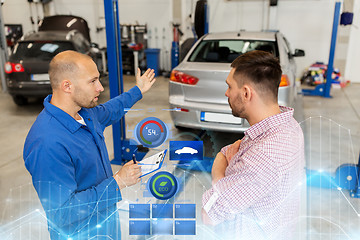 Image showing auto mechanic with clipboard and man at car shop