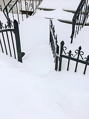 Image showing Iron fence in deep snow
