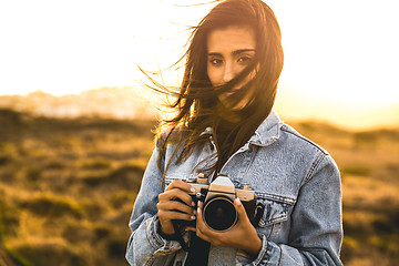 Image showing Woman Taking Picture Outdoors