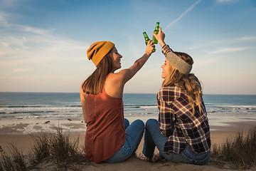 Image showing Making a toast on the beach