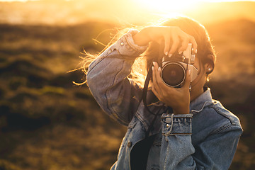 Image showing Woman Taking Picture Outdoors