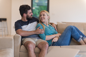 Image showing young happy couple relaxes in the living room