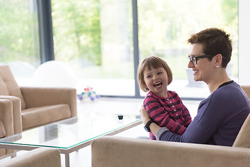 Image showing mother and cute little girl enjoying their free time