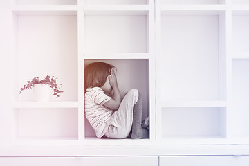 Image showing young boy posing on a shelf