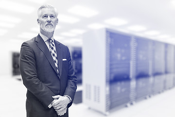 Image showing Senior businessman in server room