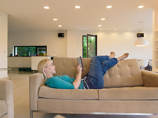 Image showing woman on sofa using tablet computer