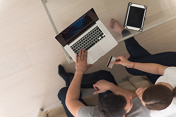 Image showing happy young couple buying online