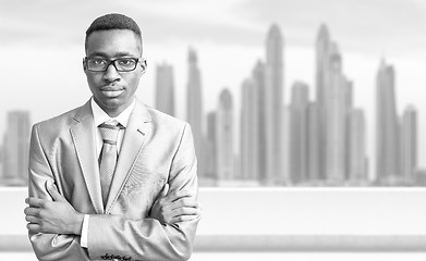 Image showing Young black businessman in front of the big city