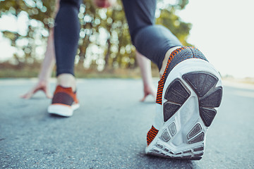 Image showing Running sport. Man runner sprinting outdoor in scenic nature. Fit muscular male athlete training trail running for marathon run.