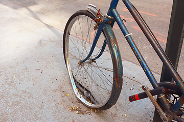 Image showing Loose tyre on abandoned, rusty bicycle