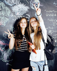 Image showing back to school after summer vacations, two teen real girls in cl