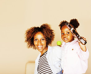 Image showing adorable sweet young afro-american mother with cute little daugh