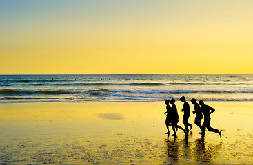 Image showing People running on the beach