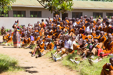 Image showing Children in uniforms playing in the cortyard of primary school in rural area near Arusha, Tanzania, Africa.