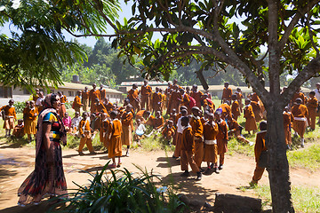 Image showing Children in uniforms playing in the cortyard of primary school in rural area near Arusha, Tanzania, Africa.