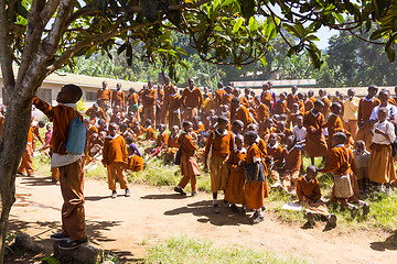 Image showing Children in uniforms playing in the cortyard of primary school in rural area near Arusha, Tanzania, Africa.