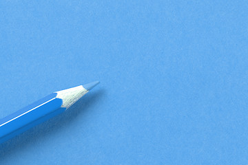 Image showing Blue crayon on blue paper