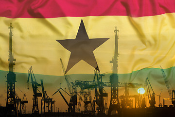 Image showing Industrial concept with Ghana flag at sunset