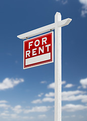 Image showing Left Facing For Rent Real Estate Sign on a Blue Sky with Clouds.