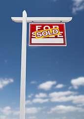 Image showing Right Facing Sold For Sale Real Estate Sign on a Blue Sky with C