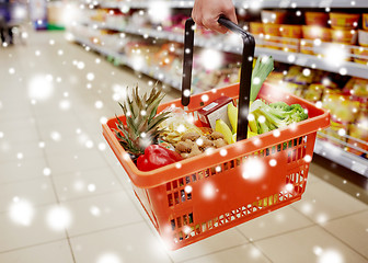 Image showing woman with food basket at grocery or supermarket