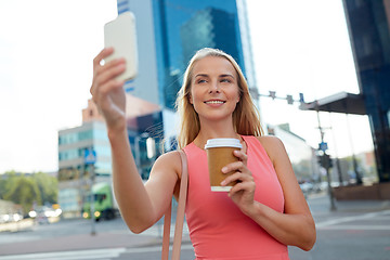 Image showing woman with coffee taking selfie by smartphone