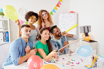 Image showing happy team taking selfie at office party