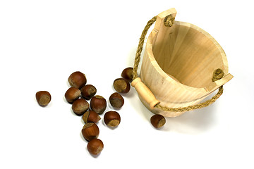 Image showing hazelnuts and empty wooden busket