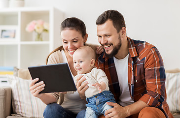 Image showing mother, father and baby with tablet pc at home