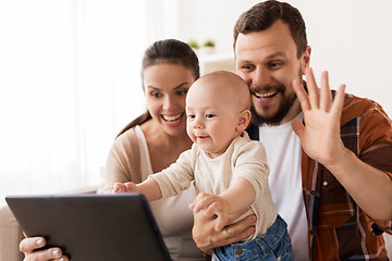 Image showing mother, father and baby with tablet pc at home