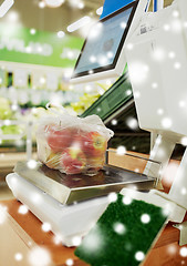 Image showing apples in plastic bag on scale at grocery store