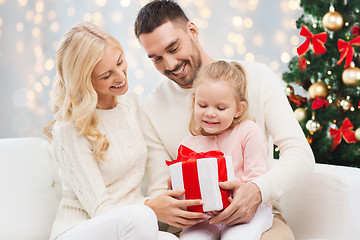 Image showing happy family with christmas gift
