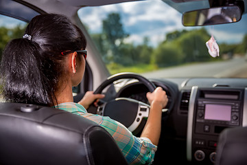 Image showing Woman behind the wheel of a car.