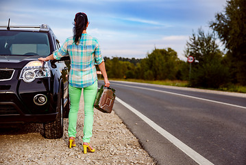 Image showing Woman with an empty tank of gas